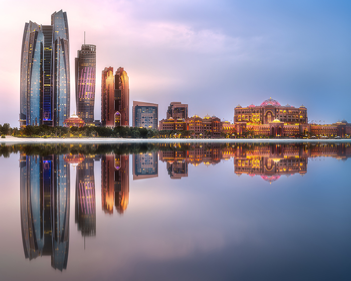 View of Abu Dhabi Skyline at sunrise with cloudy sky