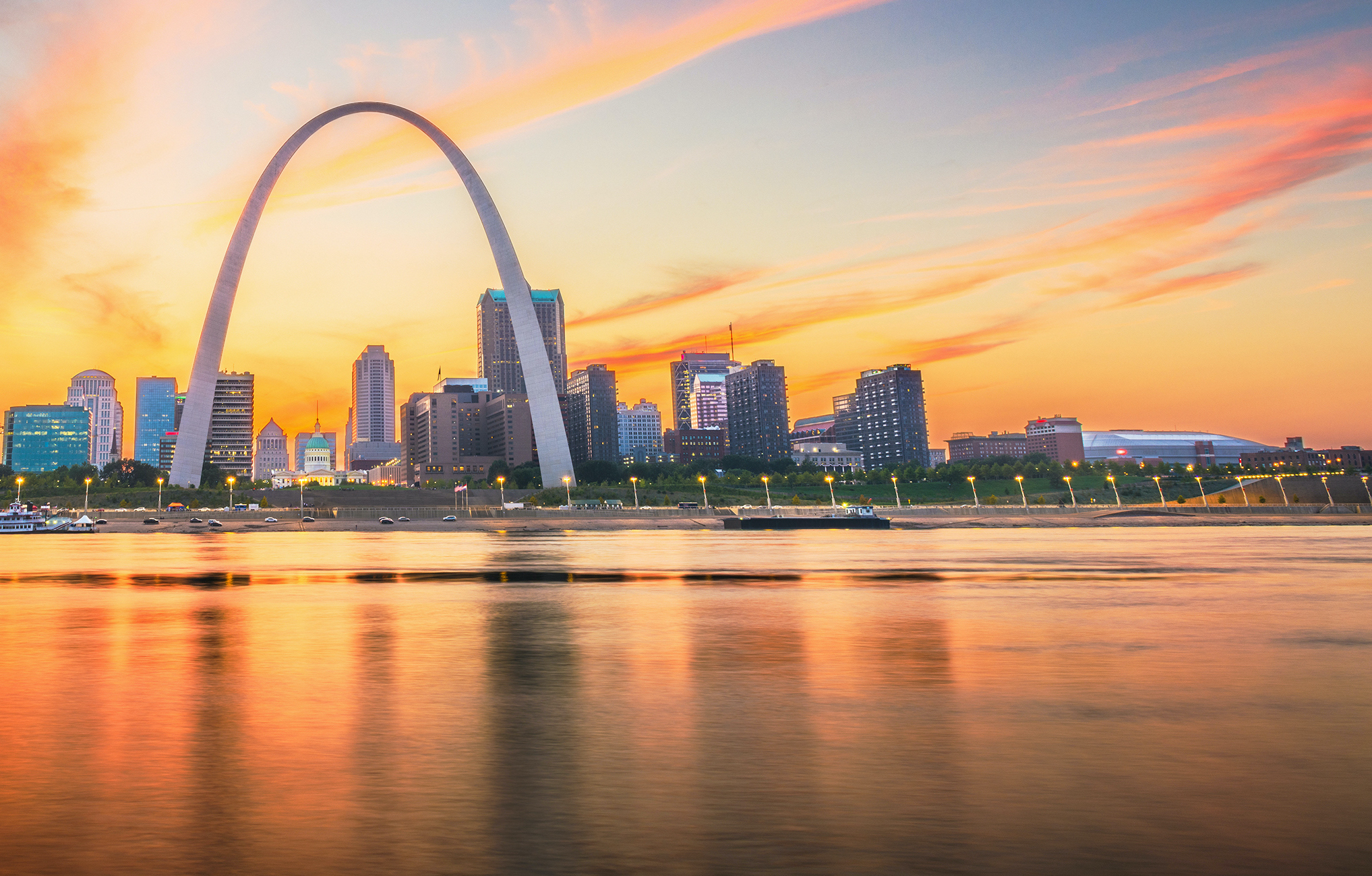 St. Louis, Missouri, USA skyline at sunset, taken from the water.